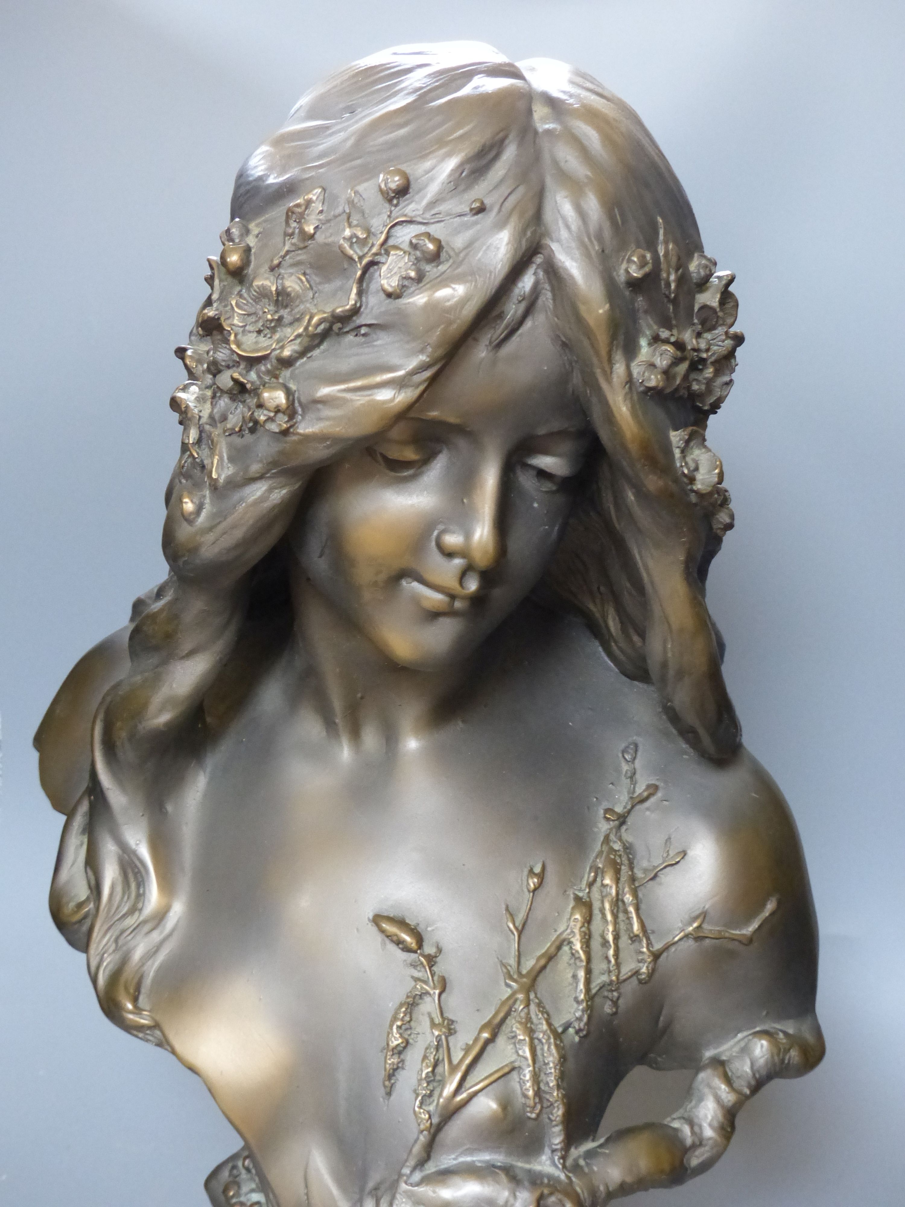 An Art Nouveau style composition bust of a girl, height 60cm